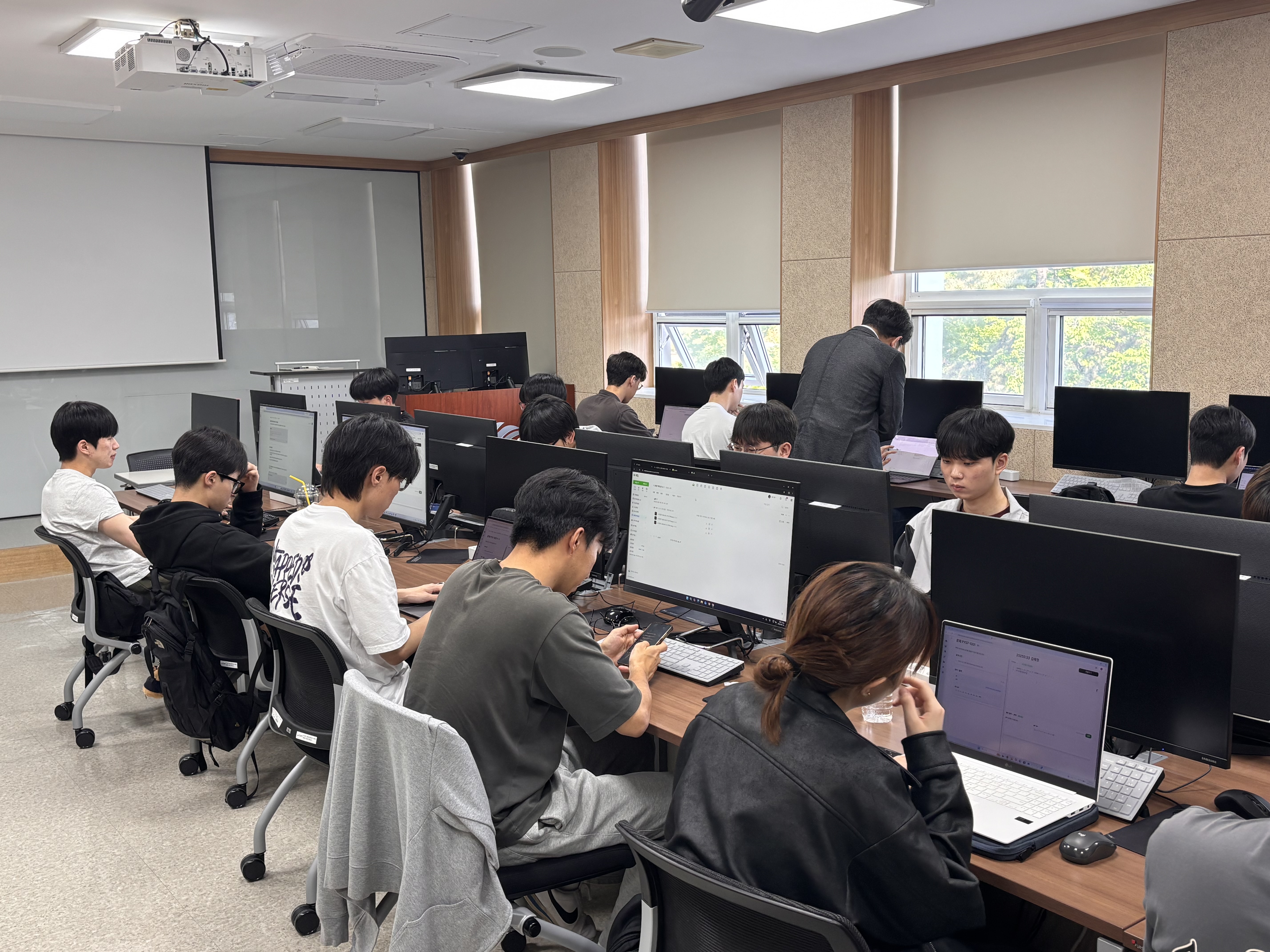 Students coding together in a computer lab